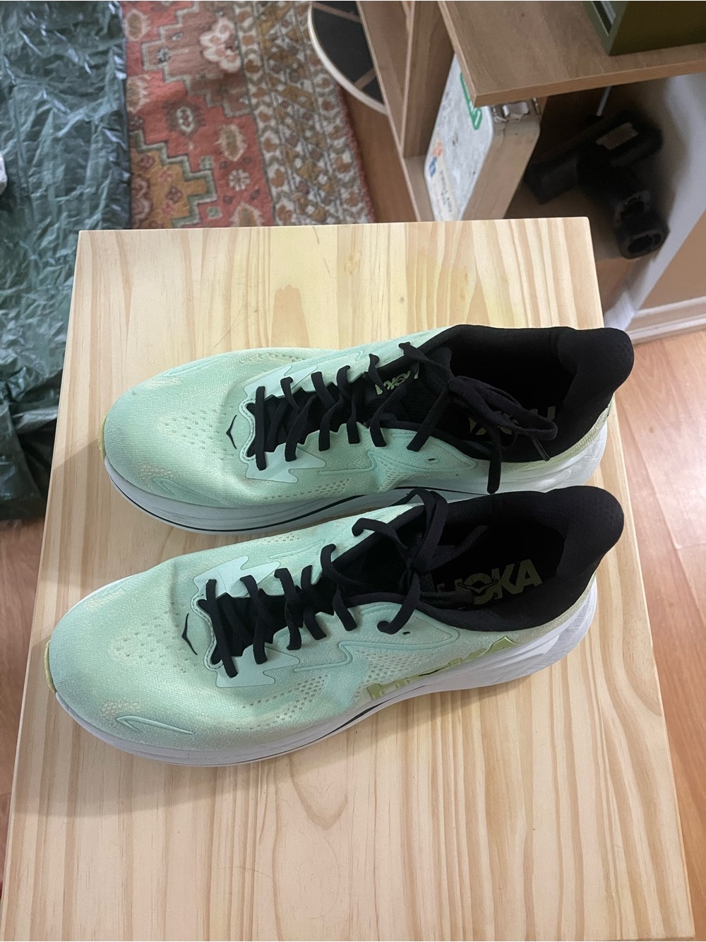 Hoka One One Black Running Shoe with Teal Logo and Mint Insole